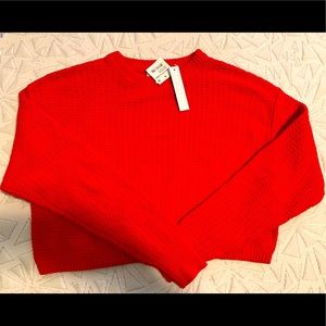 Red crop top sweater , size S and never been worn brand new .